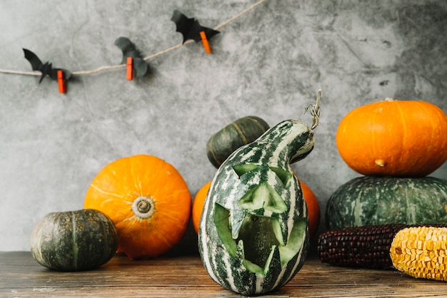 Free photo halloween composition with green gourd and bats