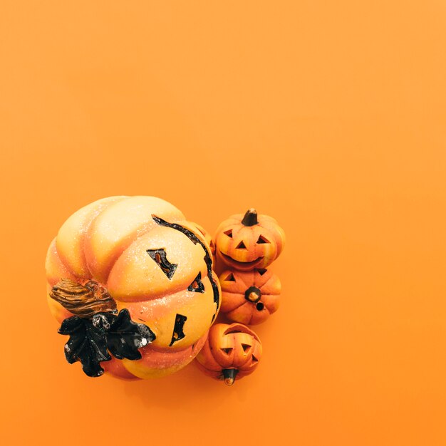 Halloween composition with happy pumpkins