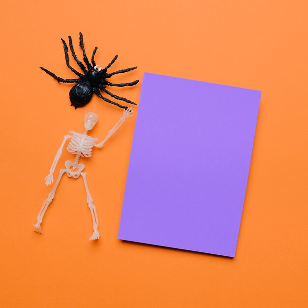 Halloween composition with purple paper