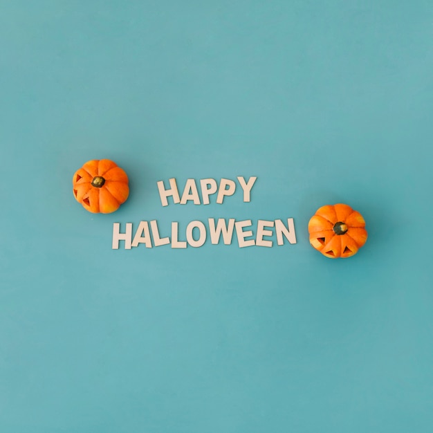 Halloween concept with letters and pumpkins