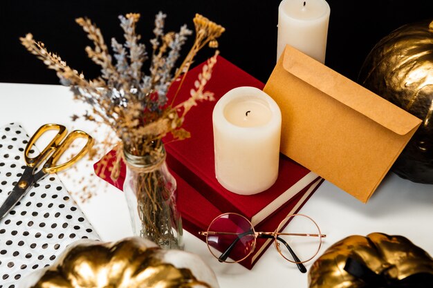 Halloween decor on white table over black surface