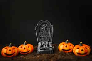 Free photo halloween decoration with grave and pumpkins