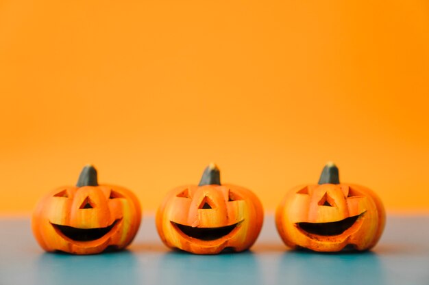 Halloween decoration with three laughing pumpkins