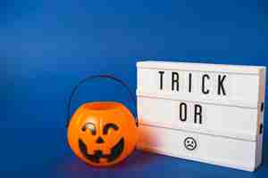 Free photo halloween false pumpkin and plastic board