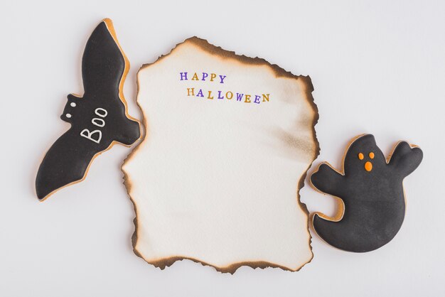 Halloween gingerbread around burning paper