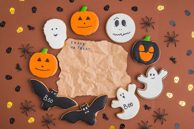 Halloween gingerbreads around wrinkled craft paper