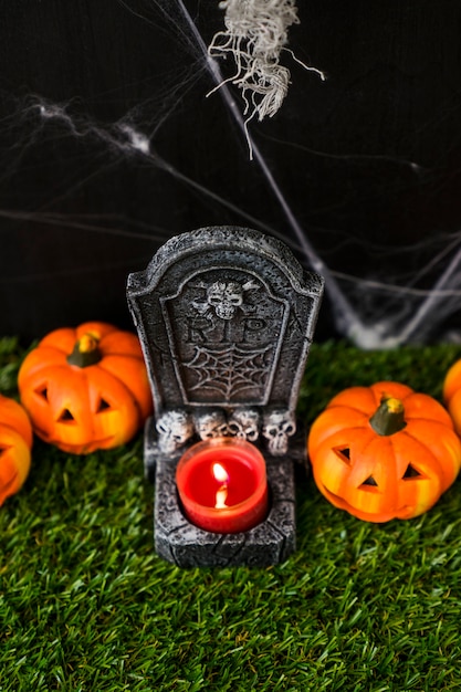 Halloween graveyard concept with candle