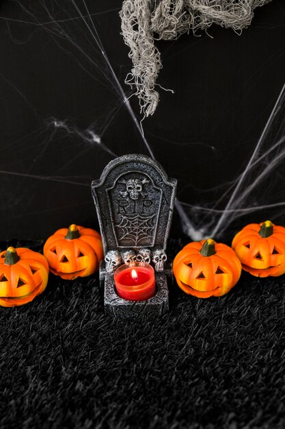 Halloween graveyard concept with pumpkins