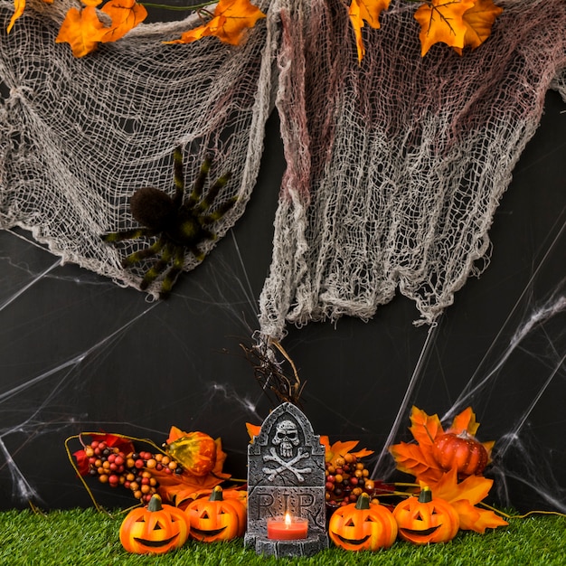 Halloween graveyard with net and pumpkins