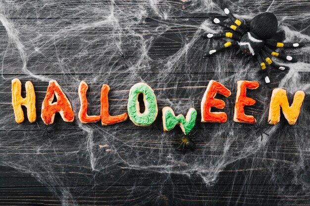 Halloween inscription from cookies and spiders