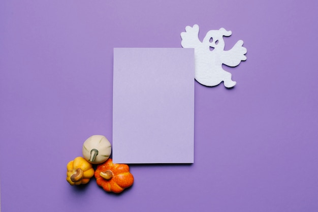 Halloween Invitation mock up for a party with pumpkins and a ghost