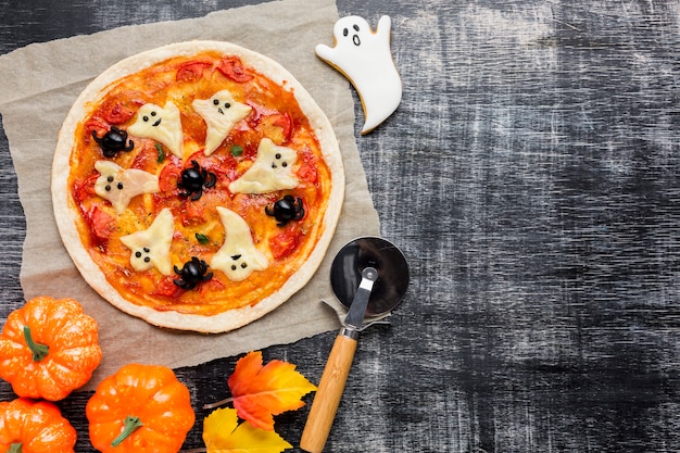 Halloween pizza with ghosts and pumpkins