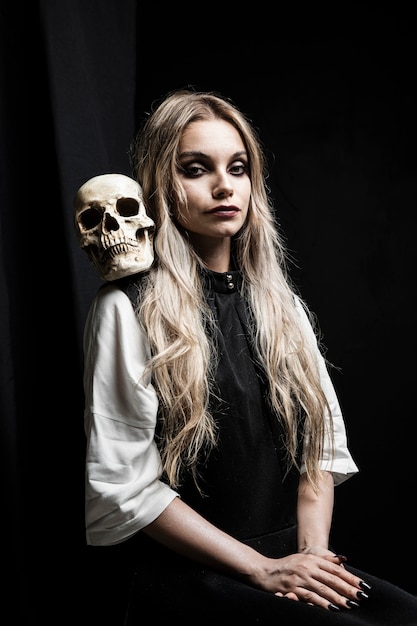 Free photo halloween portrait of woman with skull
