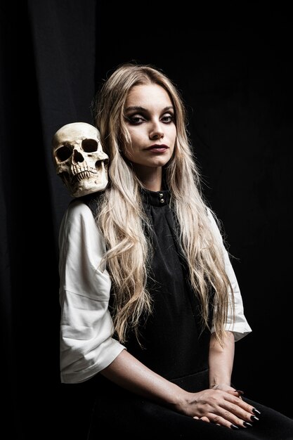halloween portrait of woman with skull