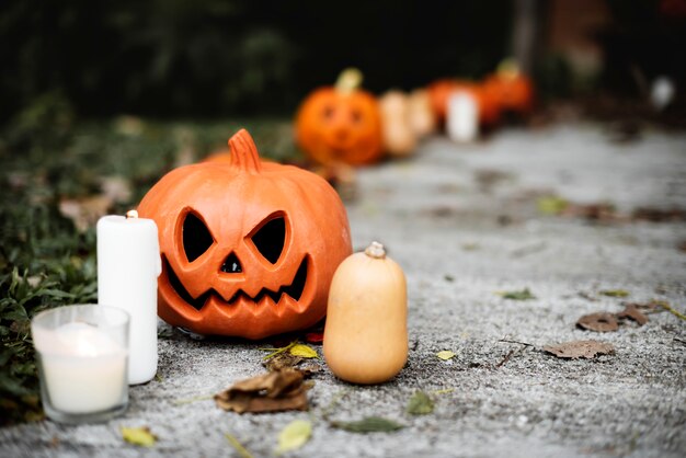 Halloween pumpkins and decorations outside a house