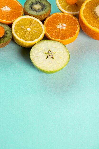 Halved fruits on a blue table