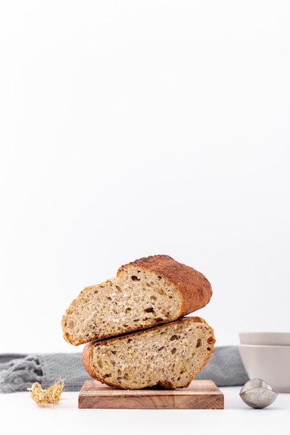 Halves of bread on a pile with copy space white background