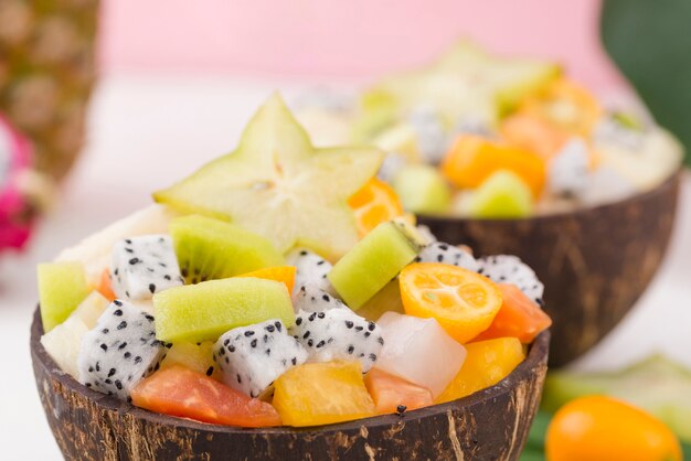 Halves of coconut filled with yummy fruit salad