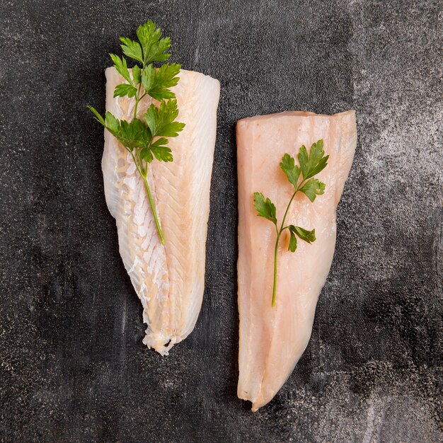 Halves of fish with parsley leaves