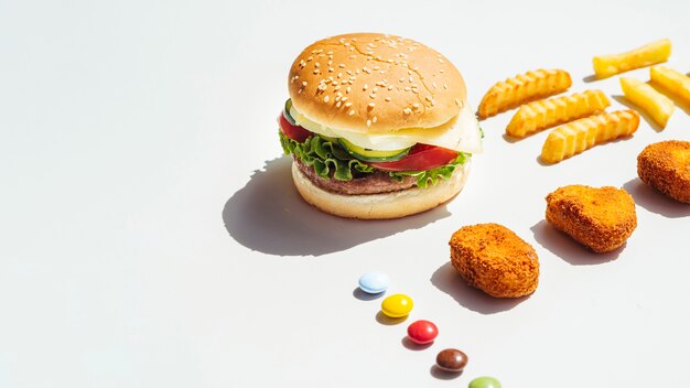 Hamburger and chicken nuggets with copy space