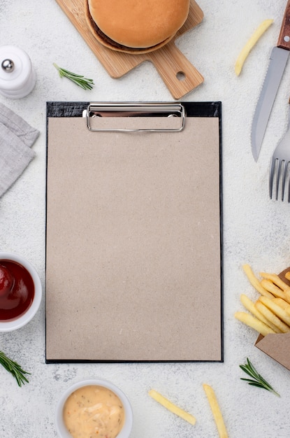 Hamburger and fries on table