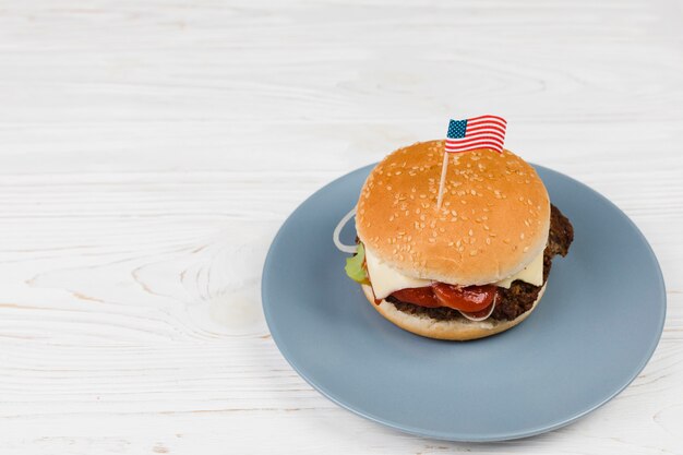 Hamburger on plate with flag