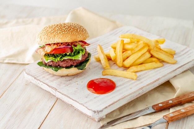 Hamburger with fries and sauce