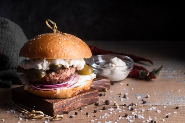 Hamburger on wooden board with copy space