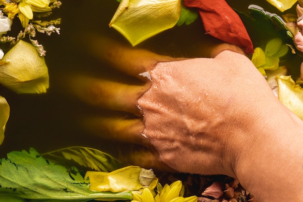 Hand in black water close-up