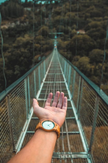 Hand on a bridge