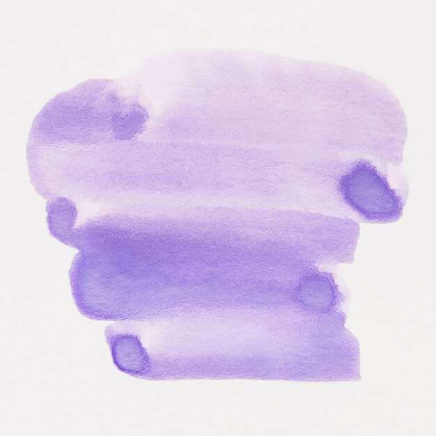 Hand drawn purple watercolor brush stain on white paper