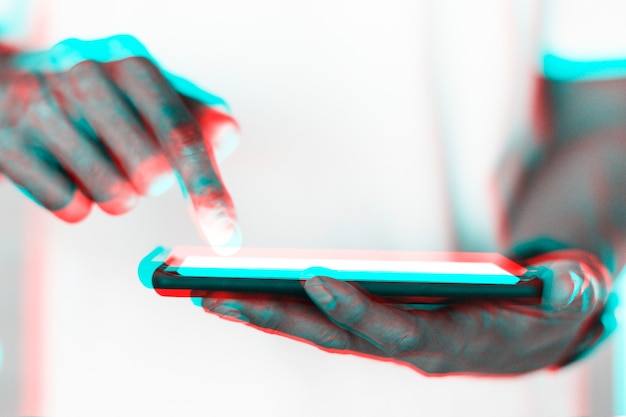 Hand and futuristic smartphone in double color exposure effect