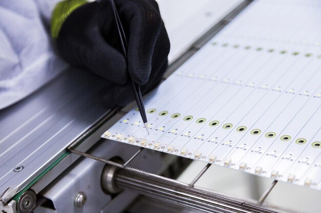 Hand in glove writing on a piece of paper