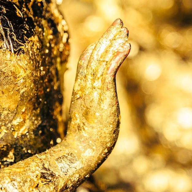 Hand of golden statue