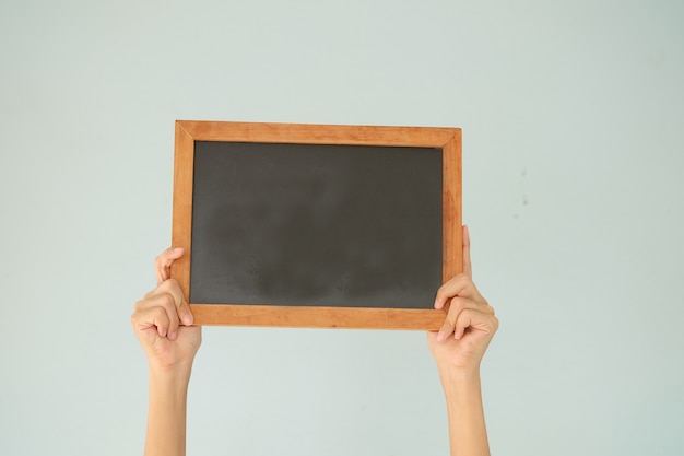 hand holding black board