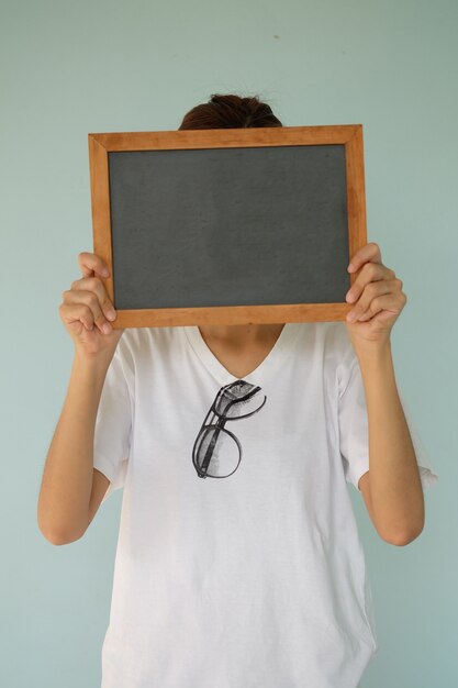 hand holding black board