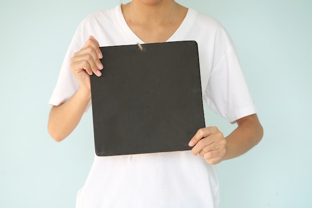 hand holding black board