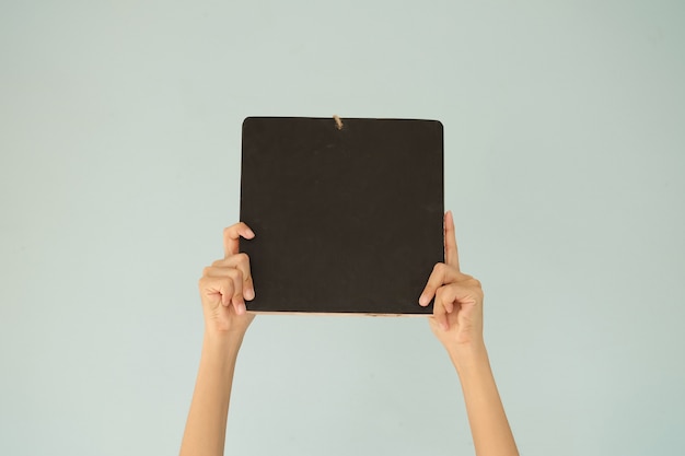 hand holding black board