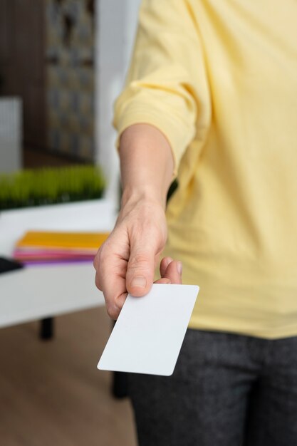 Hand holding blank business card