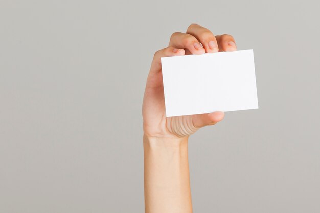 Hand holding business card