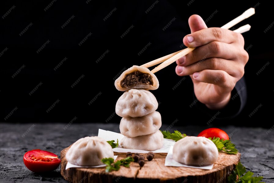 hand-holding-chopsticks-with-dumpling