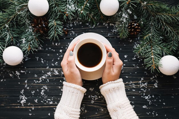 Hand holding coffee cup