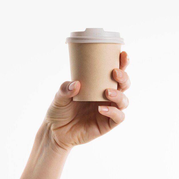 Hand holding coffee cup