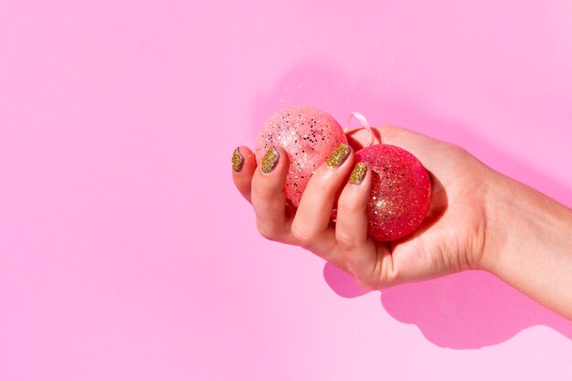 Hand holding colorful xmas balls