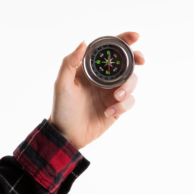 Free photo hand holding compass