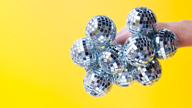 Hand holding disco balls with close-up