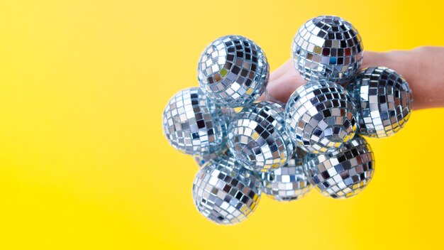 Hand holding disco balls with close-up