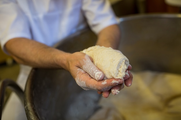 Hand holding dough