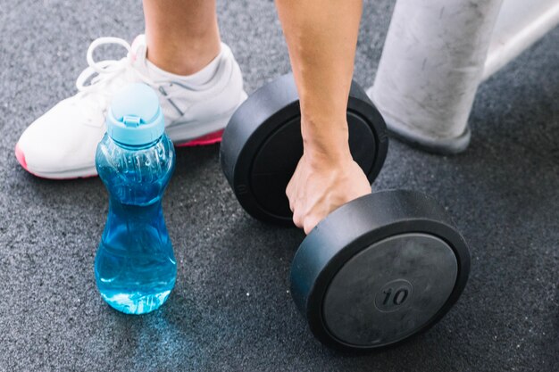 Hand holding dumbbell