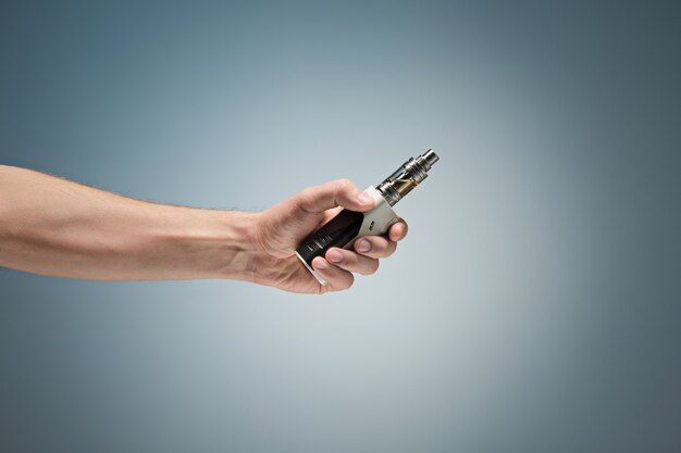 Hand holding an electronic cigarette